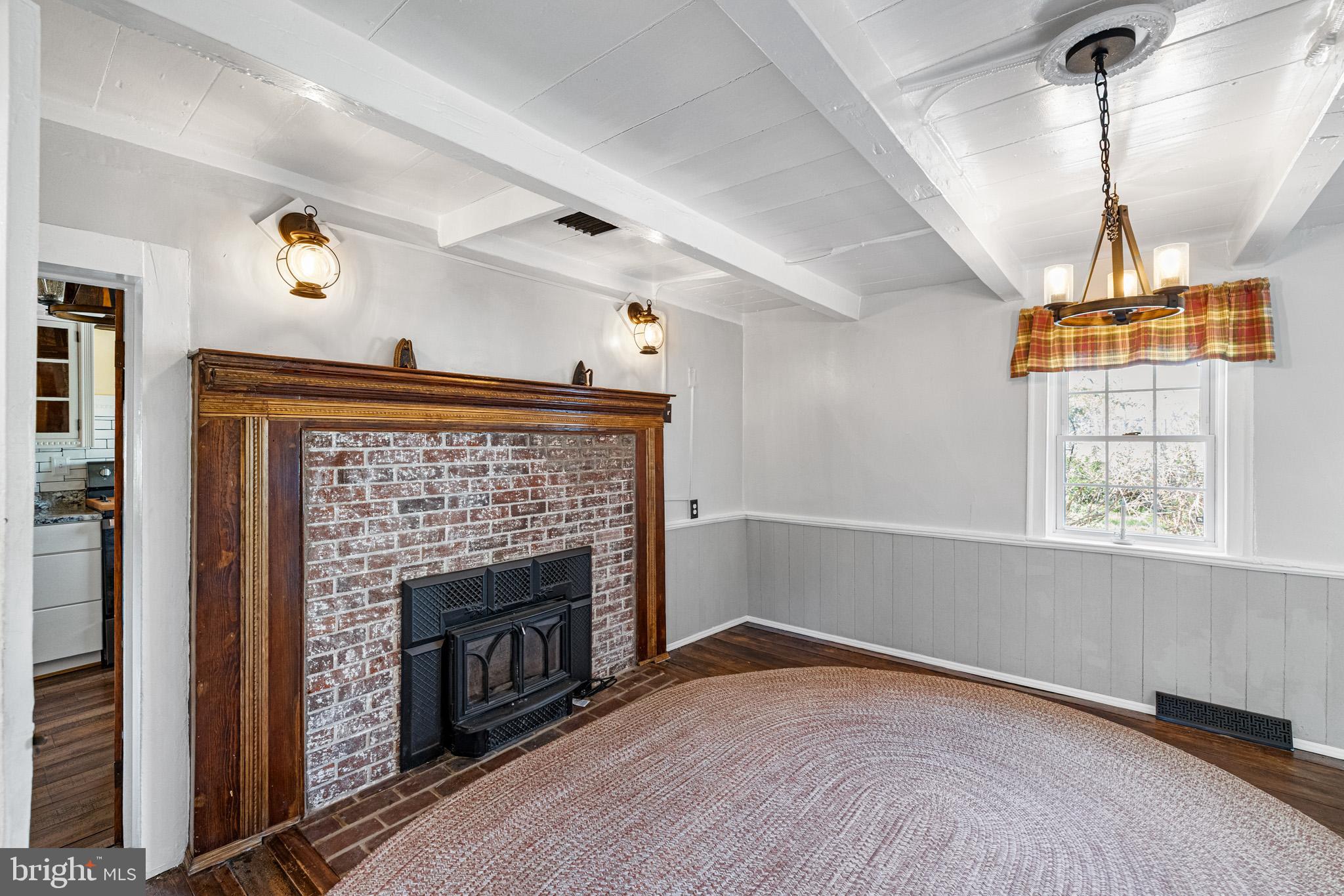 989 Swover Creek Road Edinburg, VA 22824 - Photo 31 of 132 an empty room with windows and fireplace