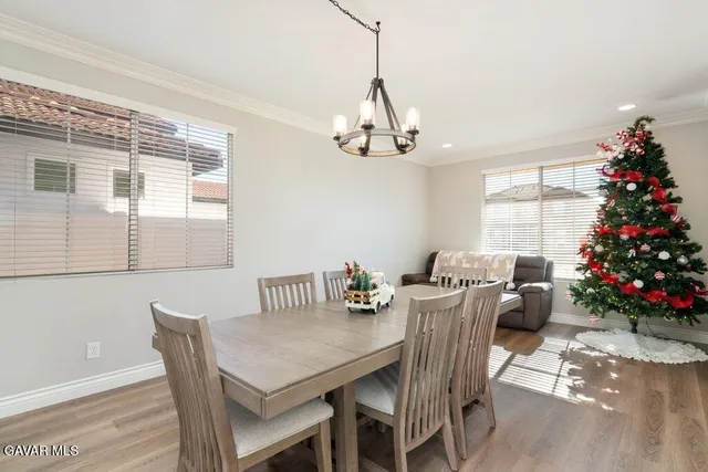 a view of a dining room with furniture window and chandelier