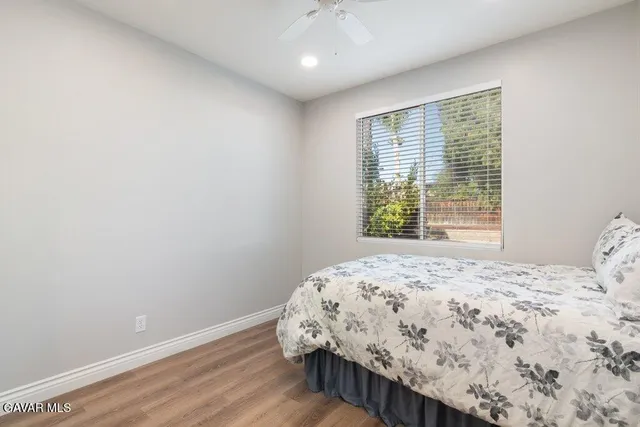 a bathroom with a toilet a sink and a mirror