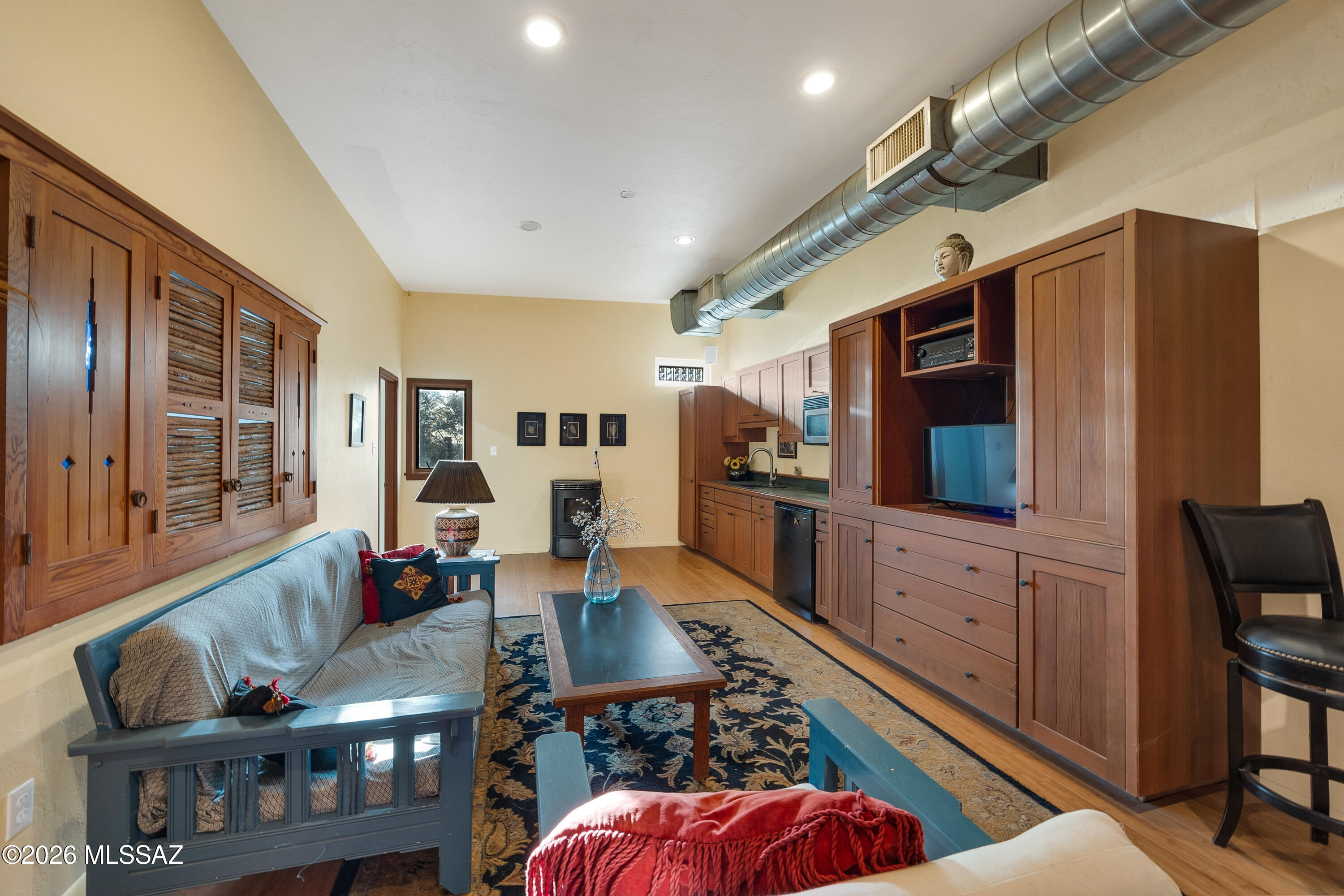 13013 East Redington Road Tucson, AZ 85749 - Photo 37 of 51 Built in 2004, the masonry stucco guest house has everything needed for a guest. Custom wood-work throughout, large entertainment cabinet has a pass through to the bedroom