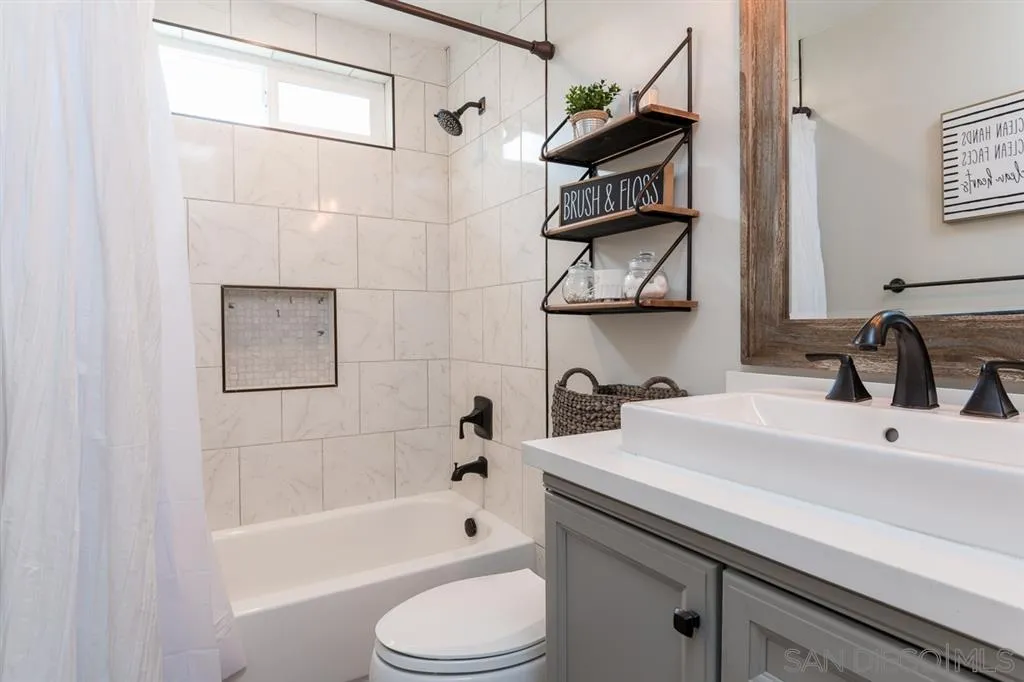 4968 Dulin Road Fallbrook, CA 92028 - Photo 20 of 25 a bathroom with a sink a toilet and bathtub