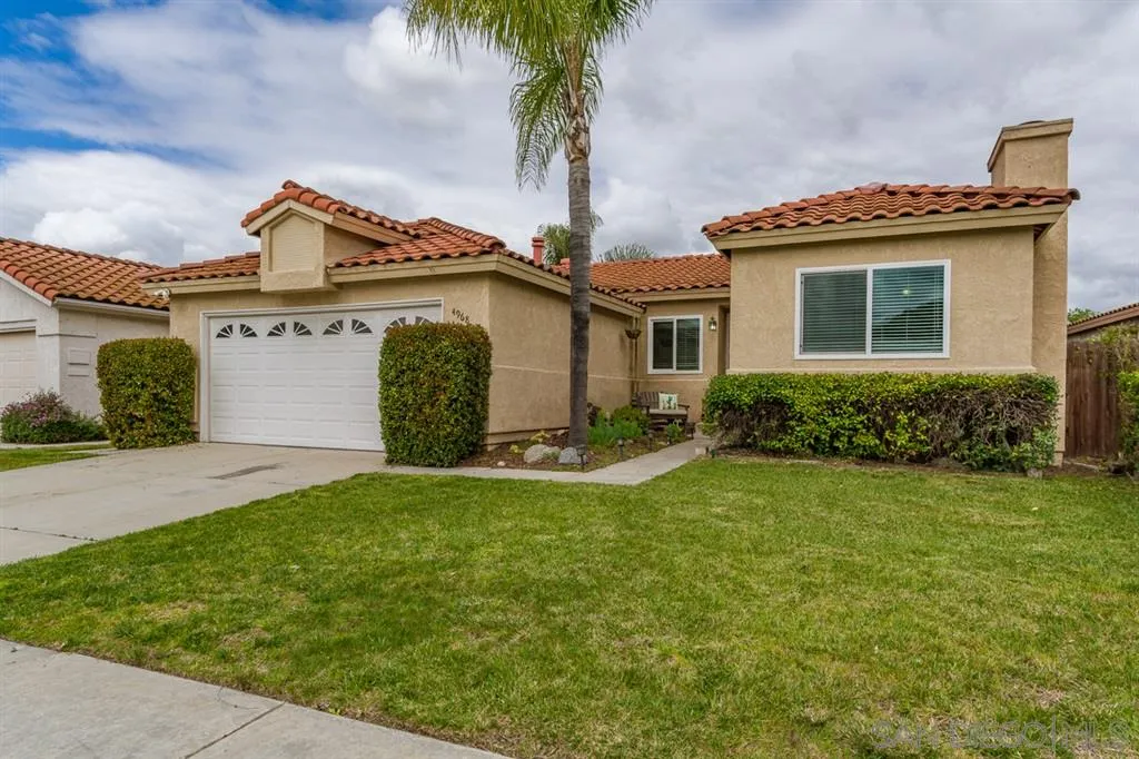 4968 Dulin Road Fallbrook, CA 92028 - Photo 3 of 25 a front view of a house with a garden and plants