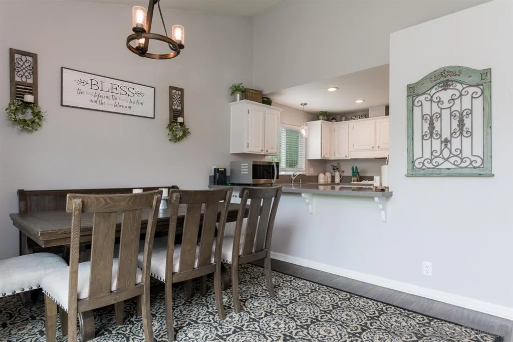 4968 Dulin Road Fallbrook, CA 92028 - Photo 5 of 25 a view of kitchen and living room with wooden floor