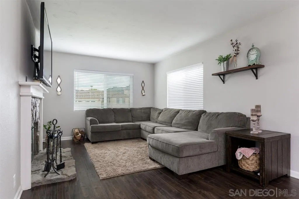 4968 Dulin Road Fallbrook, CA 92028 - Photo 7 of 25 a living room with furniture and a flat screen tv