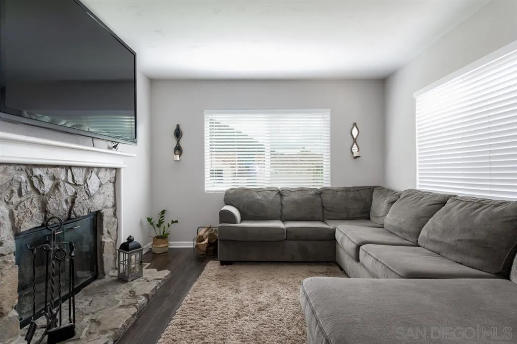 4968 Dulin Road Fallbrook, CA 92028 - Photo 8 of 25 a living room with furniture and a fireplace