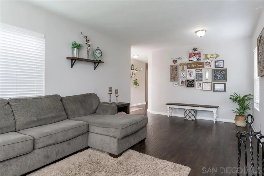 4968 Dulin Road Fallbrook, CA 92028 - Photo 9 of 25 a living room with furniture and wooden floor
