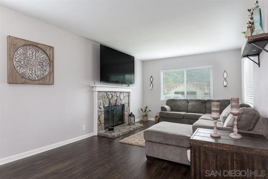 4968 Dulin Road Fallbrook, CA 92028 - Photo 10 of 25 a living room with furniture and a flat screen tv