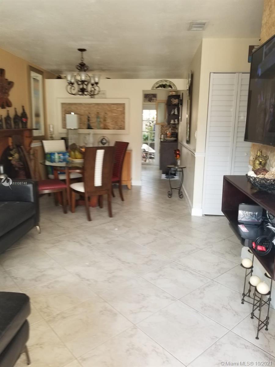 2337 West 73rd Place, Unit 7A Hialeah, FL 33016 - Photo 2 of 3 a living room with furniture