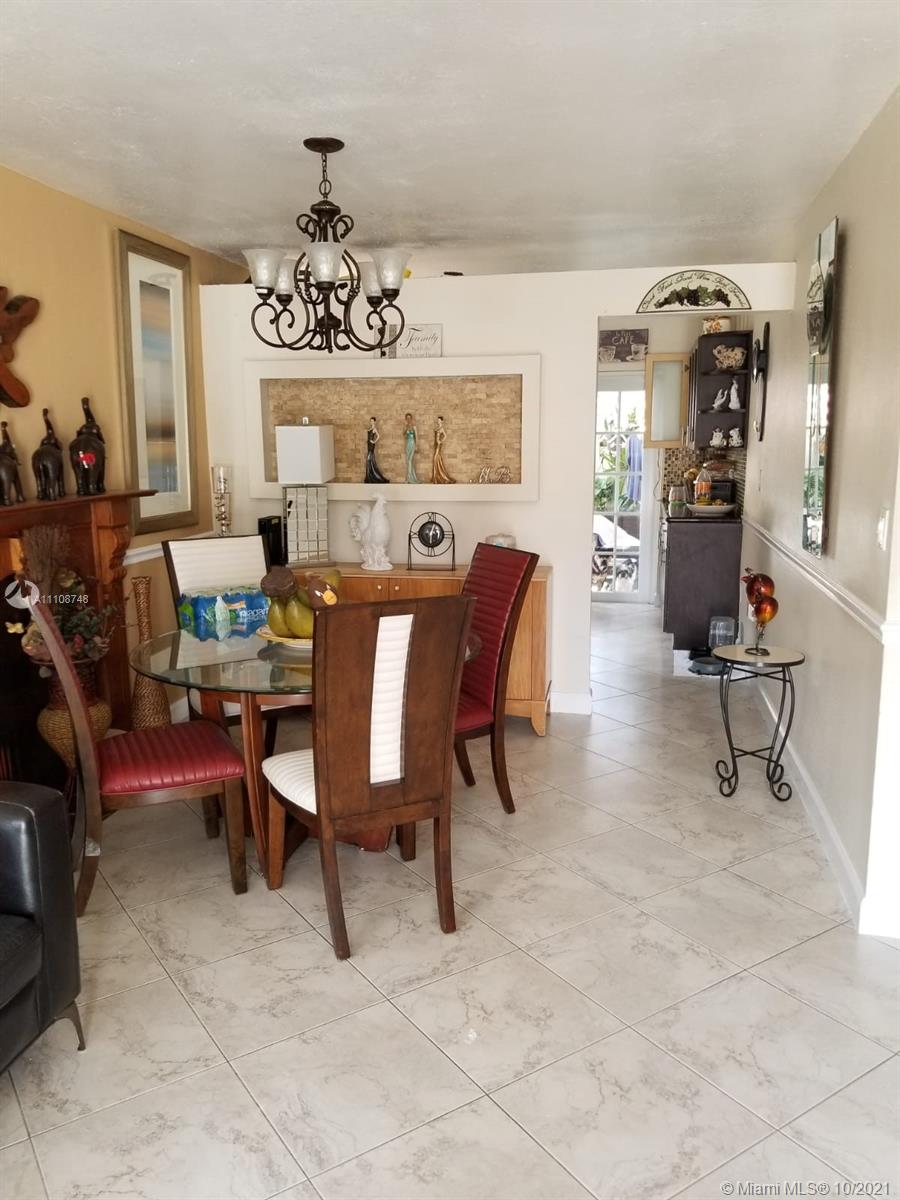 2337 West 73rd Place, Unit 7A Hialeah, FL 33016 - Photo 3 of 3 a view of a dining room with furniture
