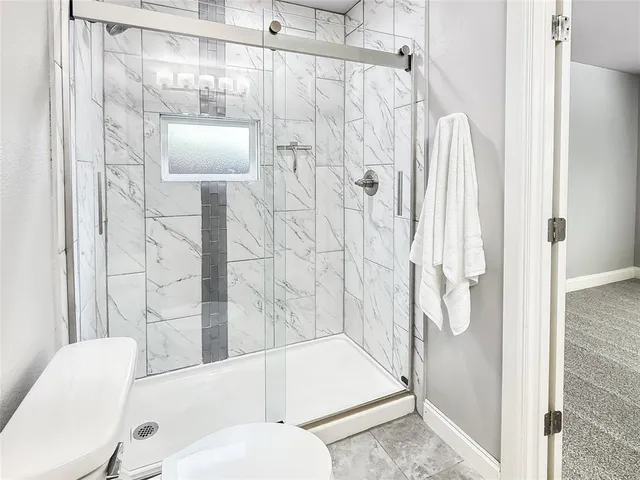 a front view of a house with a yard table and chairs