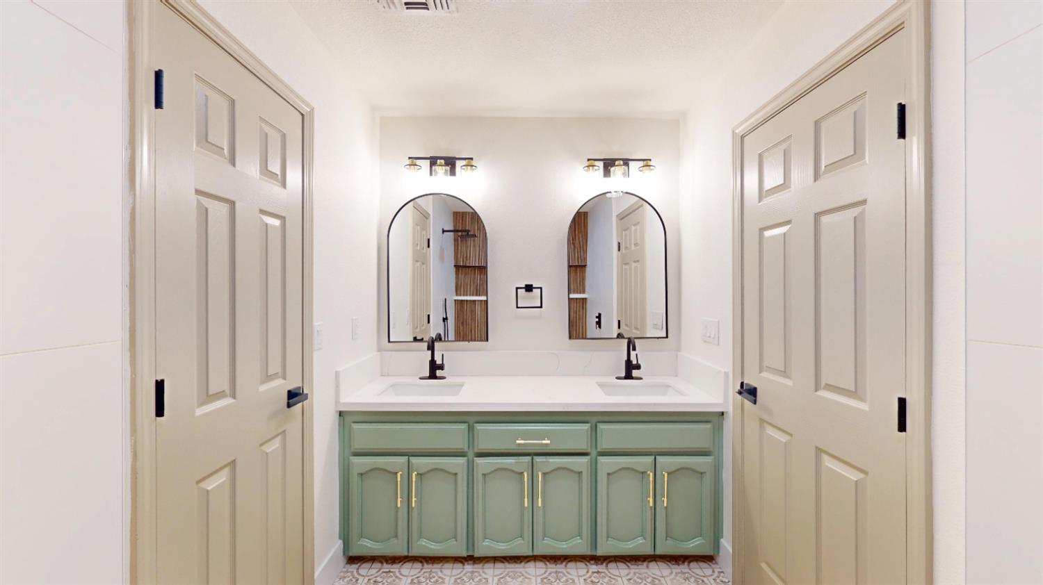16363 Paula Road Madera, CA 93636 - Photo 13 of 30 a spacious bathroom with a double vanity sink and a mirror