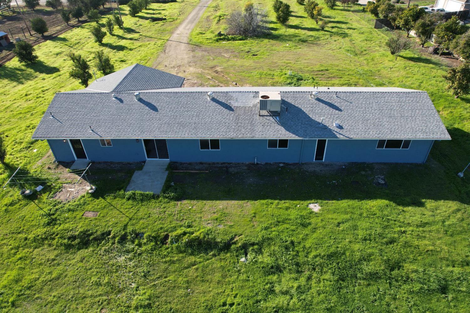 16363 Paula Road Madera, CA 93636 - Photo 25 of 30 an aerial view of residential houses with outdoor space and trees