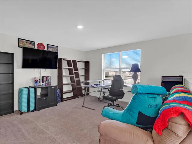 a living room with a couch and a window