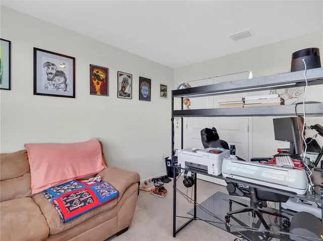 a bathroom with a sink a toilet and shower curtain