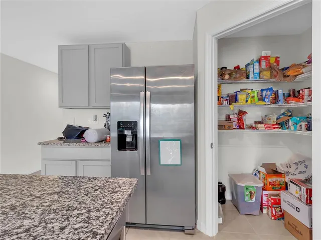a kitchen with stainless steel appliances granite countertop a sink and a stove