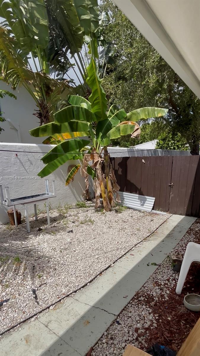 571 Northeast 67th Street, Unit 1 Miami, FL 33138 - Photo 11 of 13 a vase of flowers sitting on a table