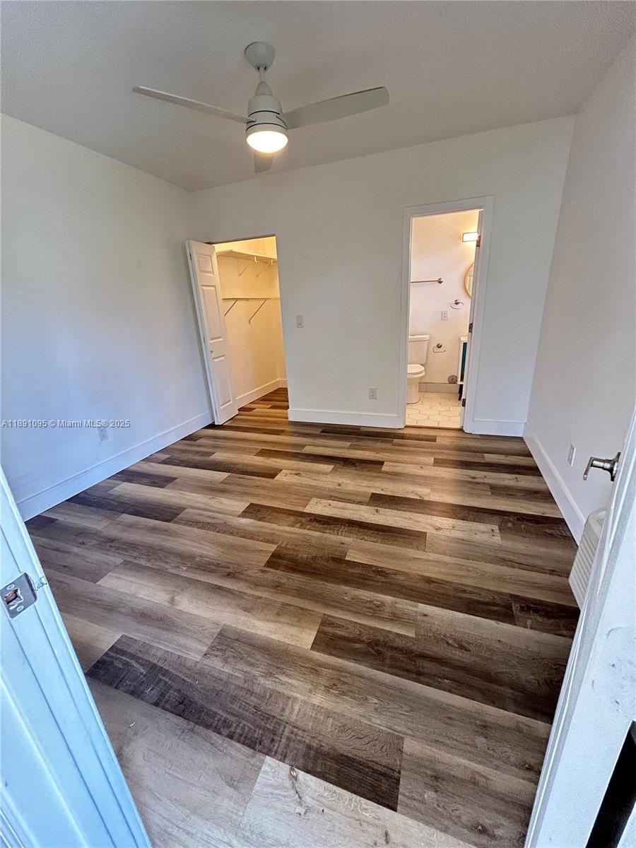 571 Northeast 67th Street, Unit 1 Miami, FL 33138 - Photo 5 of 13 a bedroom with a bed and a window