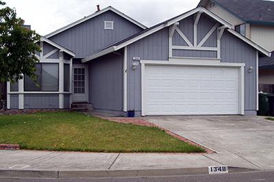 1348 Middlebrook Way Rohnert Park, CA 94928 - Photo 1 of 1 a front view of a house with a yard and garage
