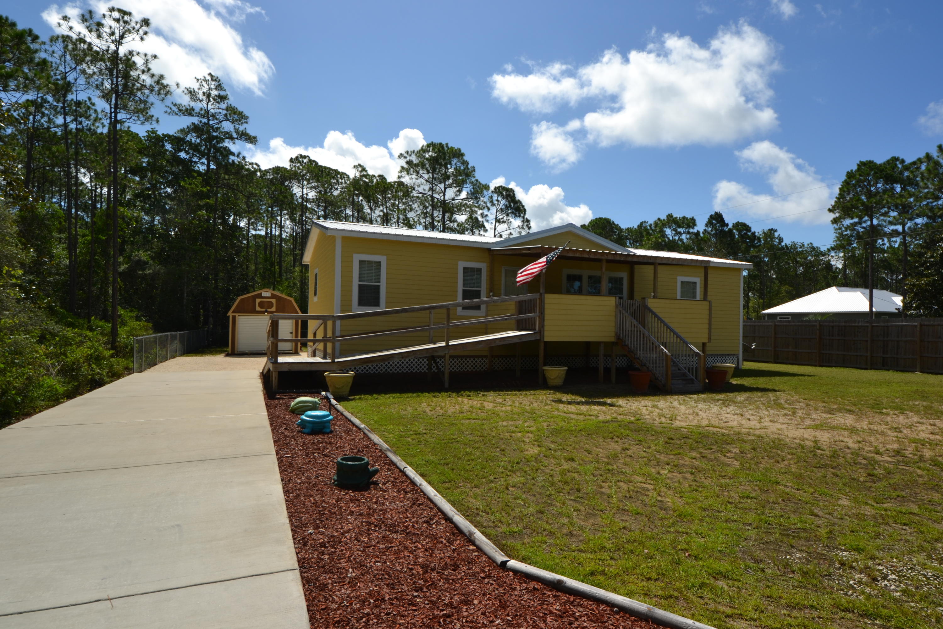 16 17th Street Santa Rosa Beach, FL 32459 - Photo 1 of 40 a view of a back yard of the house