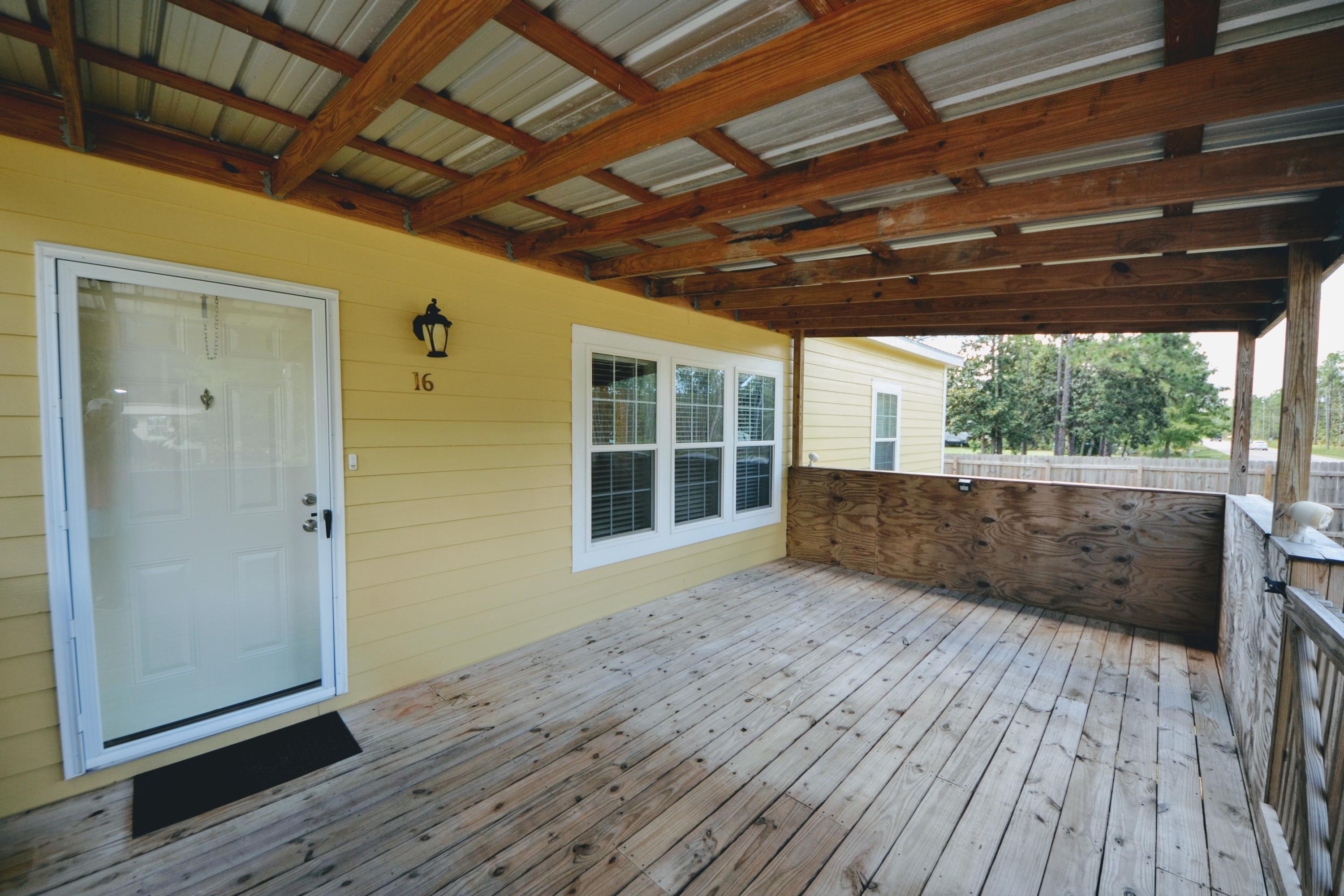 16 17th Street Santa Rosa Beach, FL 32459 - Photo 15 of 40 a view of porch with wooden floor