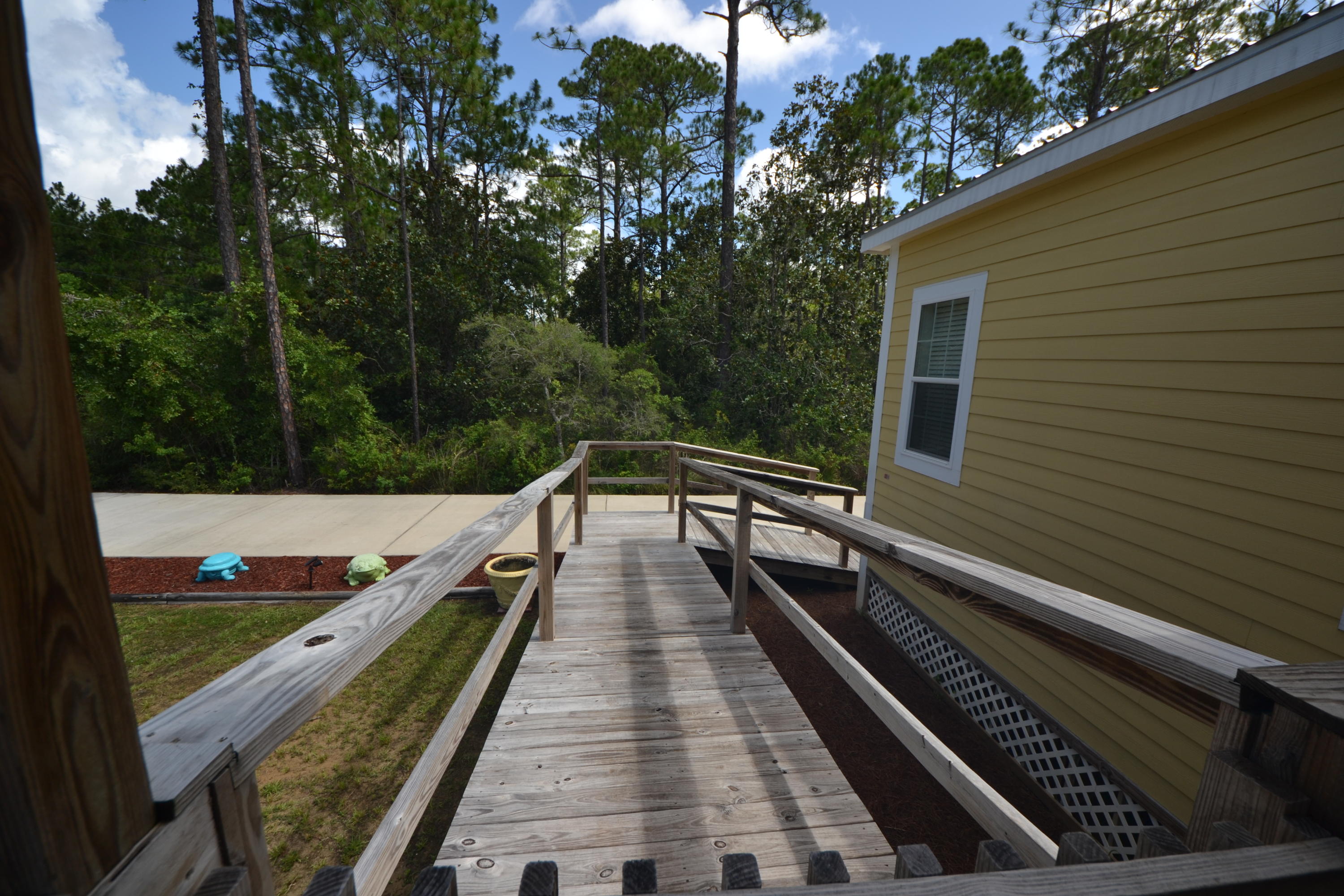 16 17th Street Santa Rosa Beach, FL 32459 - Photo 16 of 40 a view of a balcony with wooden floor and fence