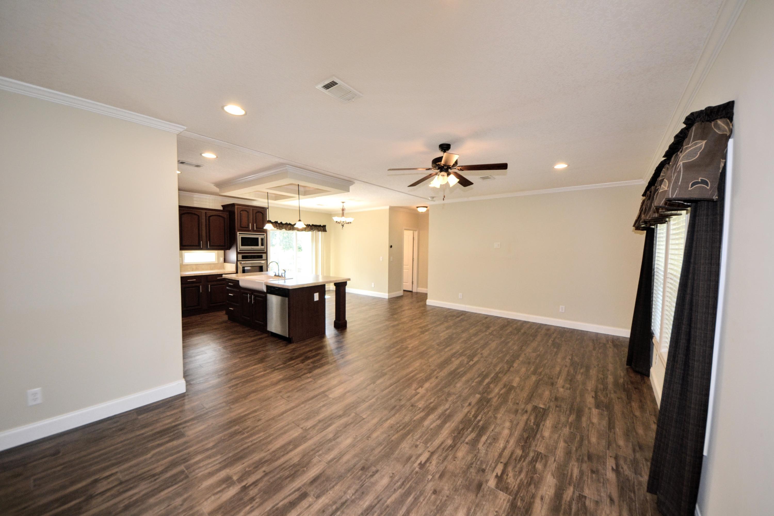 16 17th Street Santa Rosa Beach, FL 32459 - Photo 26 of 40 a view of kitchen and hall with wooden floor