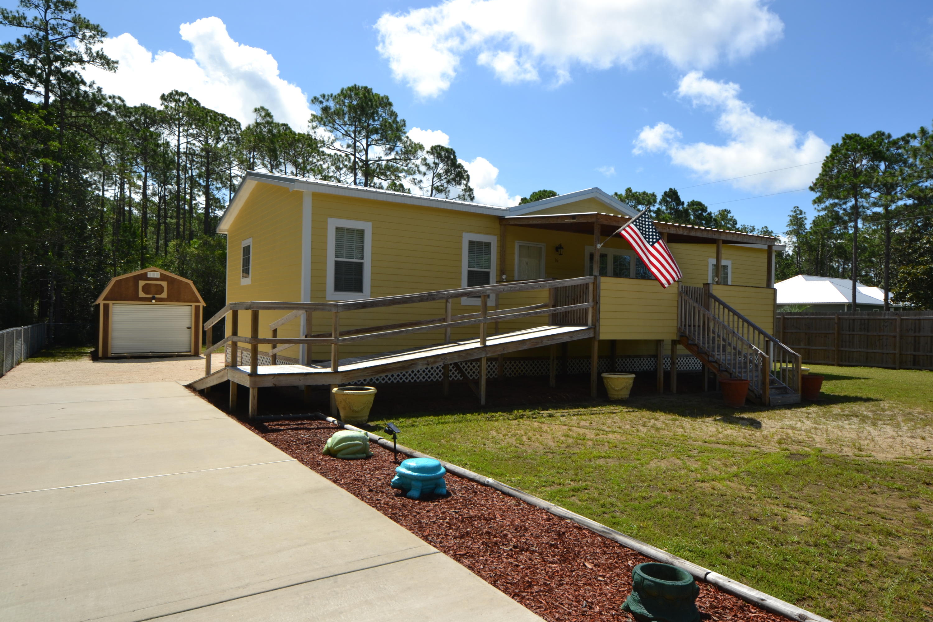 16 17th Street Santa Rosa Beach, FL 32459 - Photo 3 of 40 a view of a backyard with sitting area