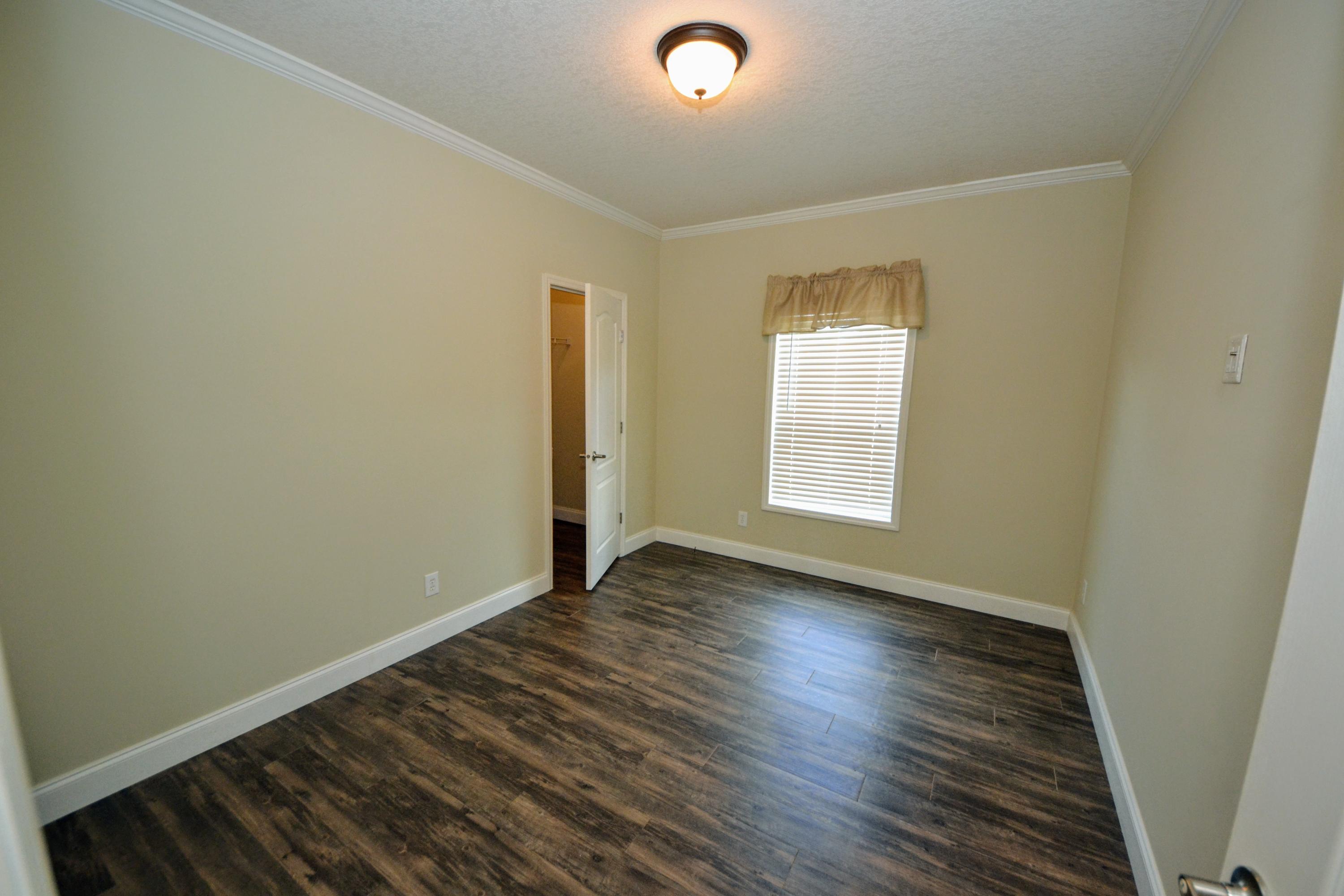 16 17th Street Santa Rosa Beach, FL 32459 - Photo 34 of 40 an empty room with wooden floor and windows