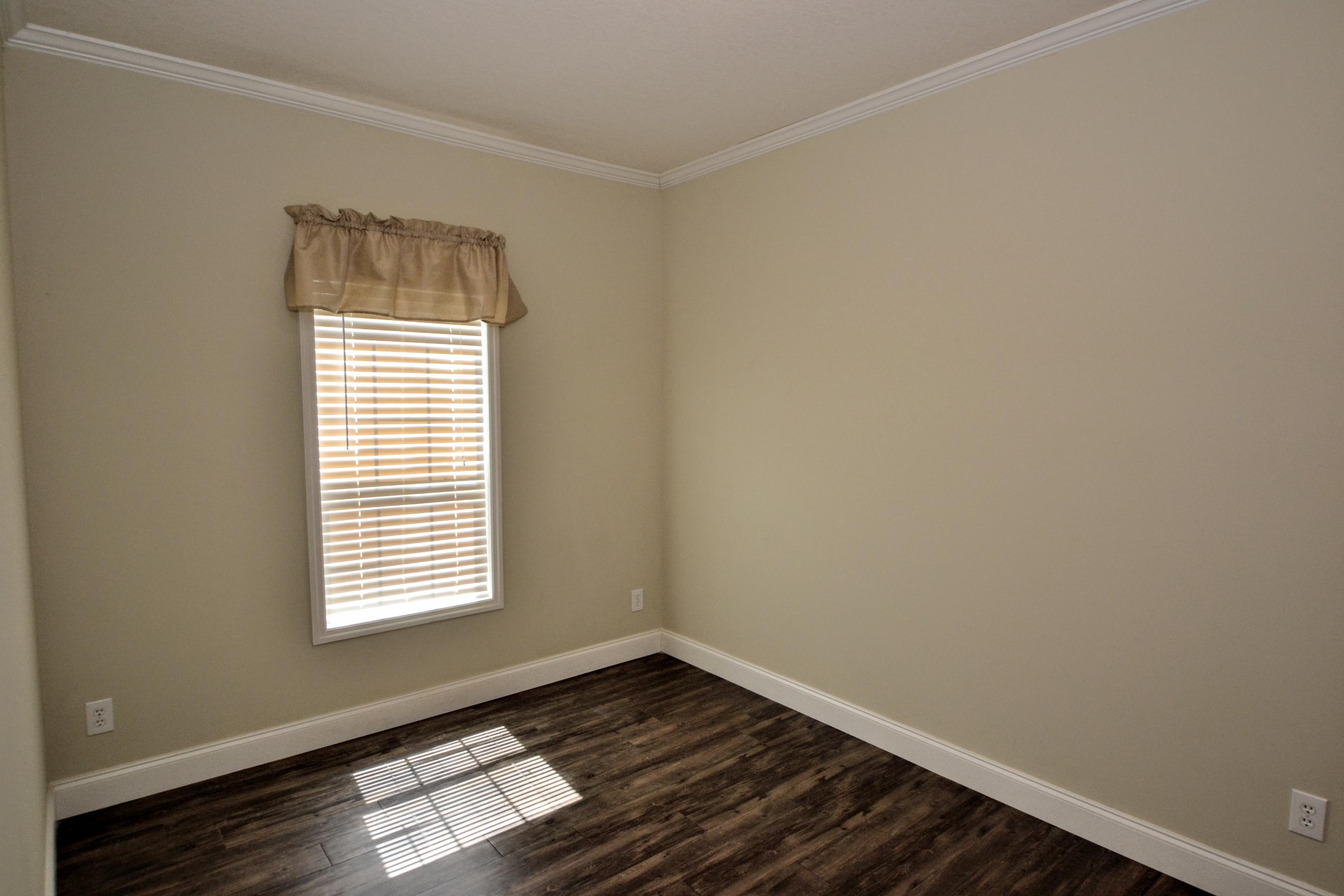 16 17th Street Santa Rosa Beach, FL 32459 - Photo 38 of 40 a view of an empty room with wooden floor and a window