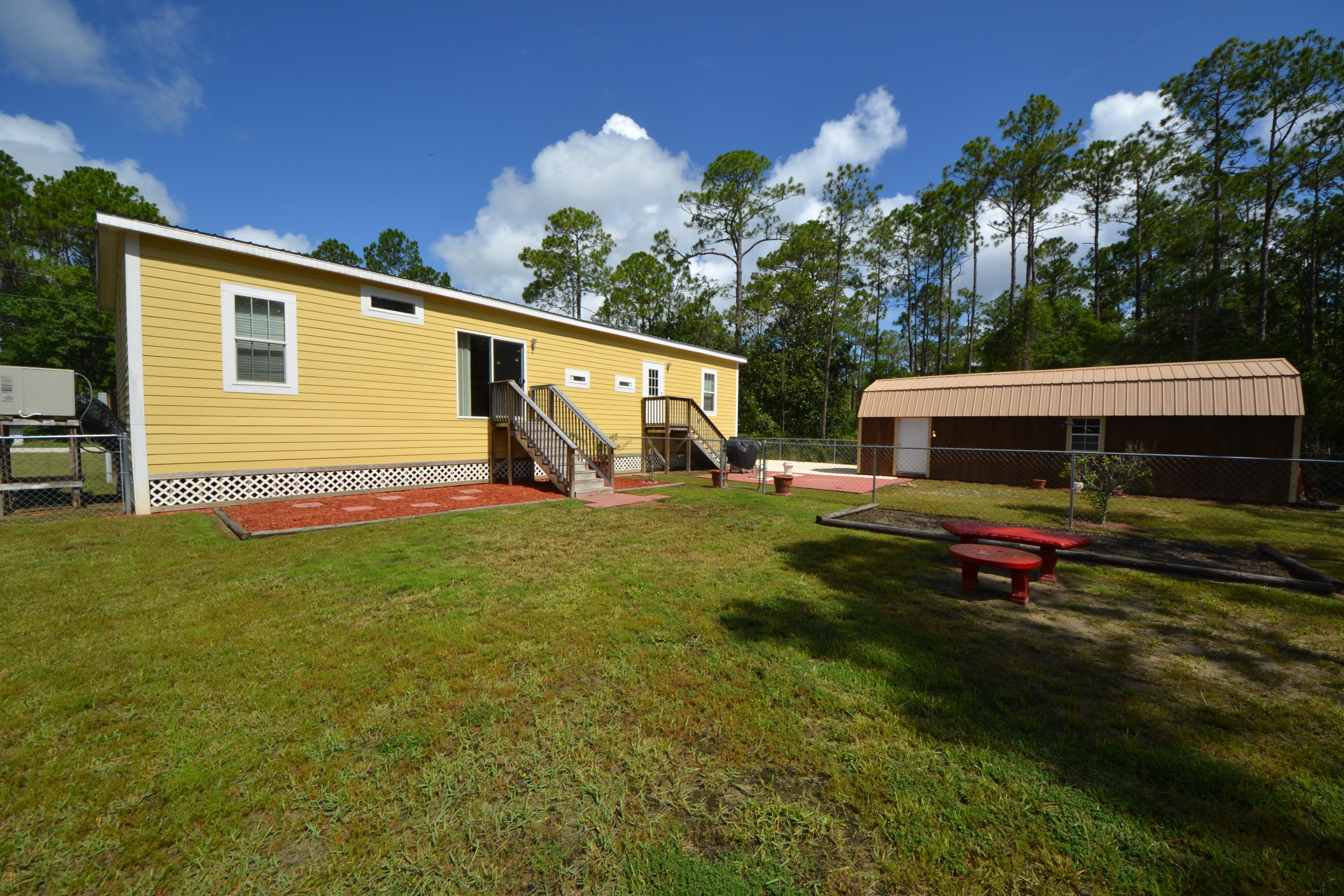 16 17th Street Santa Rosa Beach, FL 32459 - Photo 8 of 40 a front view of a house with a yard