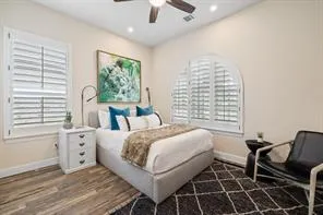 a bed room with a bed and a chair