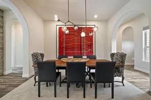 a dining room with furniture and window