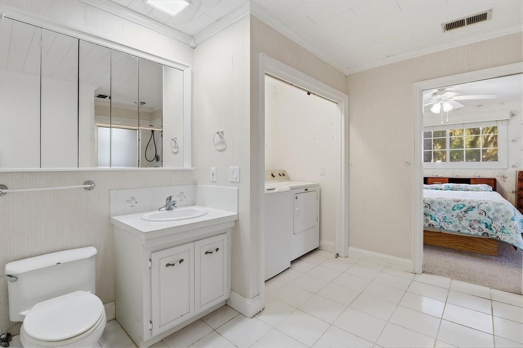 11 Patricia Road Yankeetown, FL 34498 - Photo 12 of 30 a spacious bathroom with a double vanity sink and mirror