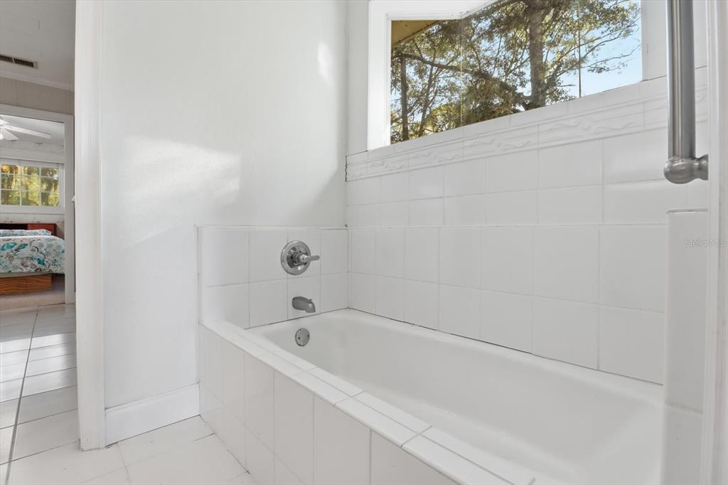 11 Patricia Road Yankeetown, FL 34498 - Photo 16 of 30 a white bath tub sitting next to a window