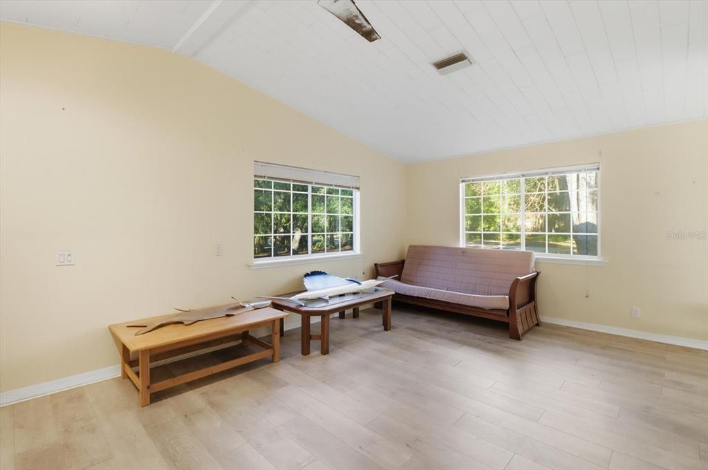 11 Patricia Road Yankeetown, FL 34498 - Photo 18 of 30 a bedroom with a bed and a window