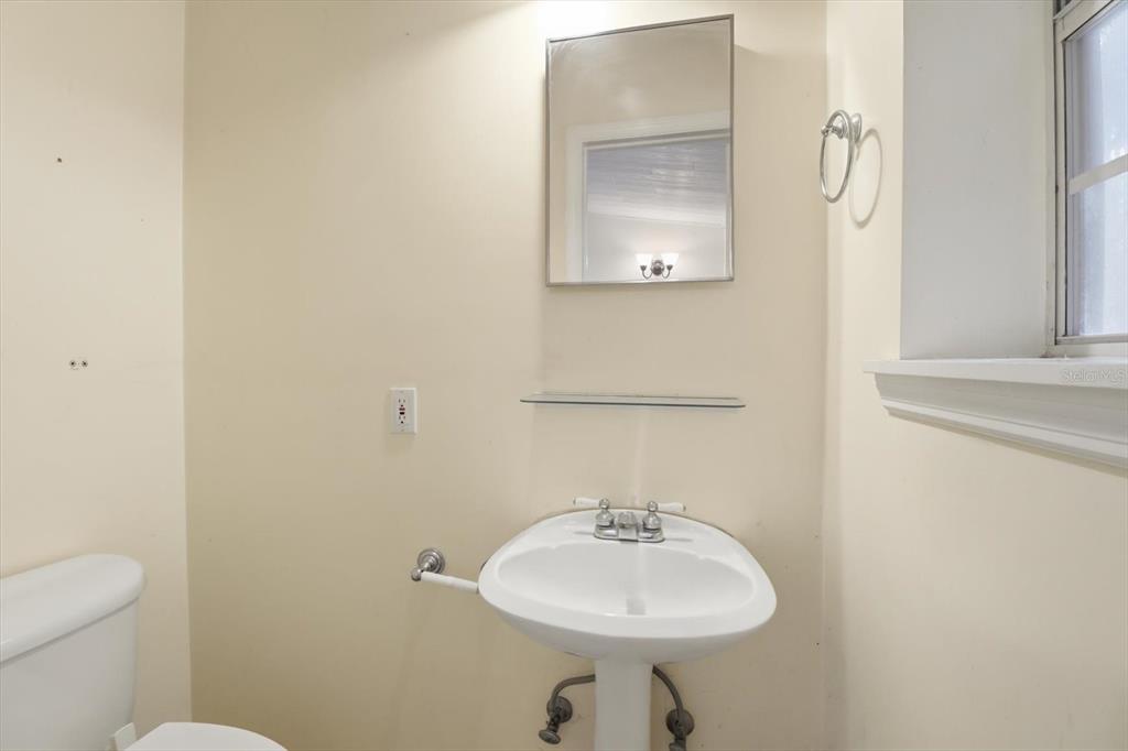 11 Patricia Road Yankeetown, FL 34498 - Photo 20 of 30 a bathroom with a sink a toilet and mirror