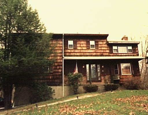 36 Beaver Brook Road Ridgefield, CT 06877 - Photo 1 of 1 a front view of a house with garden
