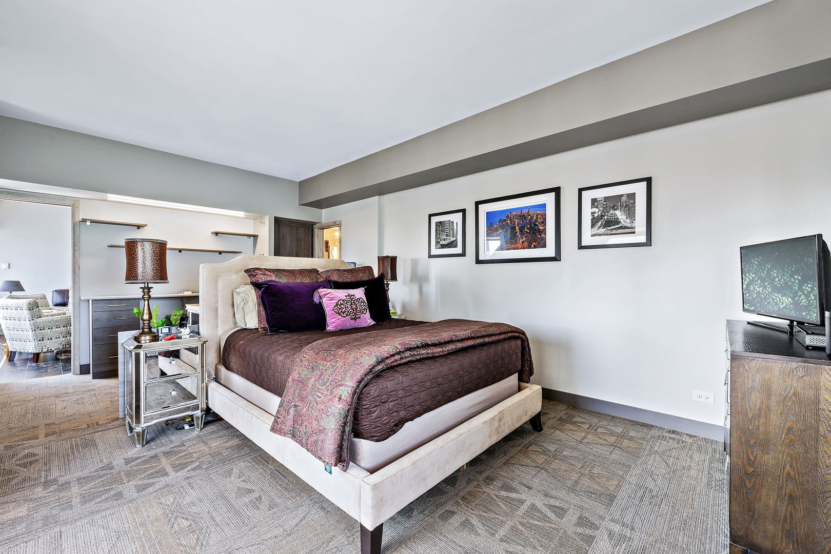 175 East Delaware Place, Unit 5412 Chicago, IL 60611 - Photo 11 of 20 a spacious bedroom with a bed and a tv