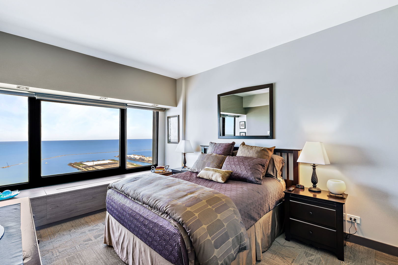 175 East Delaware Place, Unit 5412 Chicago, IL 60611 - Photo 17 of 20 a bedroom with a bed and large window