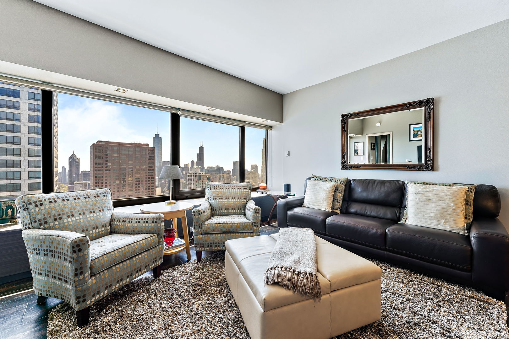 175 East Delaware Place, Unit 5412 Chicago, IL 60611 - Photo 4 of 20 a living room with furniture and a large window