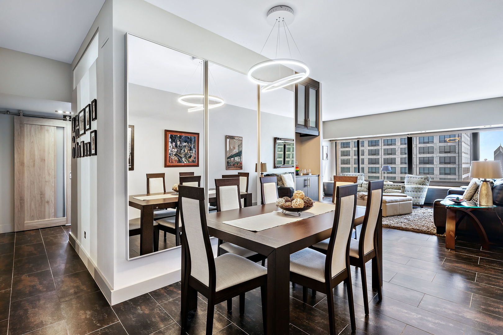 175 East Delaware Place, Unit 5412 Chicago, IL 60611 - Photo 6 of 20 a view of a dining room with furniture and wooden floor