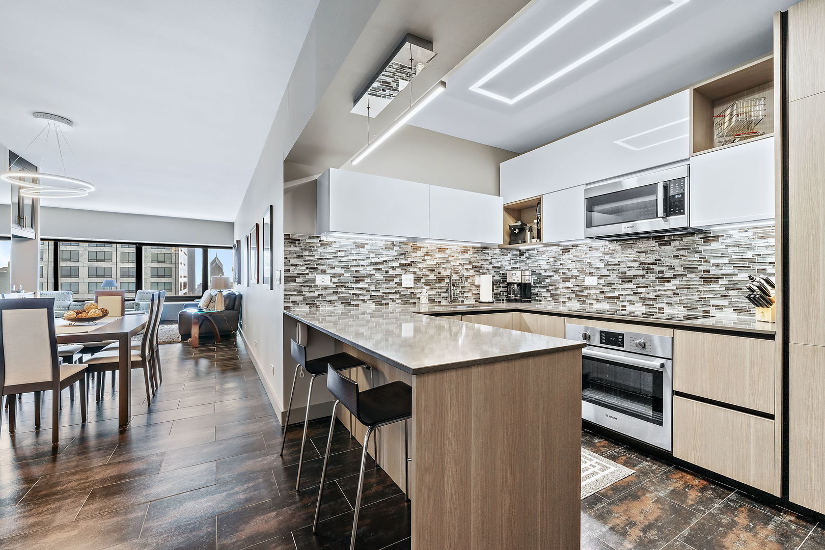 175 East Delaware Place, Unit 5412 Chicago, IL 60611 - Photo 9 of 20 a kitchen with stainless steel appliances granite countertop a stove and cabinets