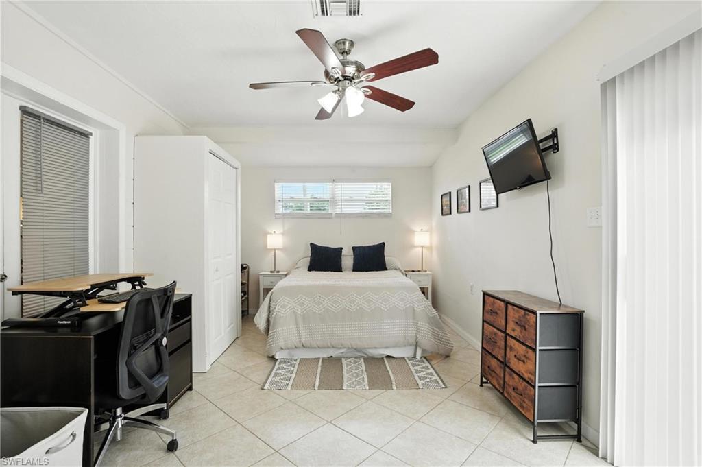 1423 Charles Road Fort Myers, FL 33919 - Photo 11 of 26 Bedroom featuring light tile patterned floors and ceiling fan