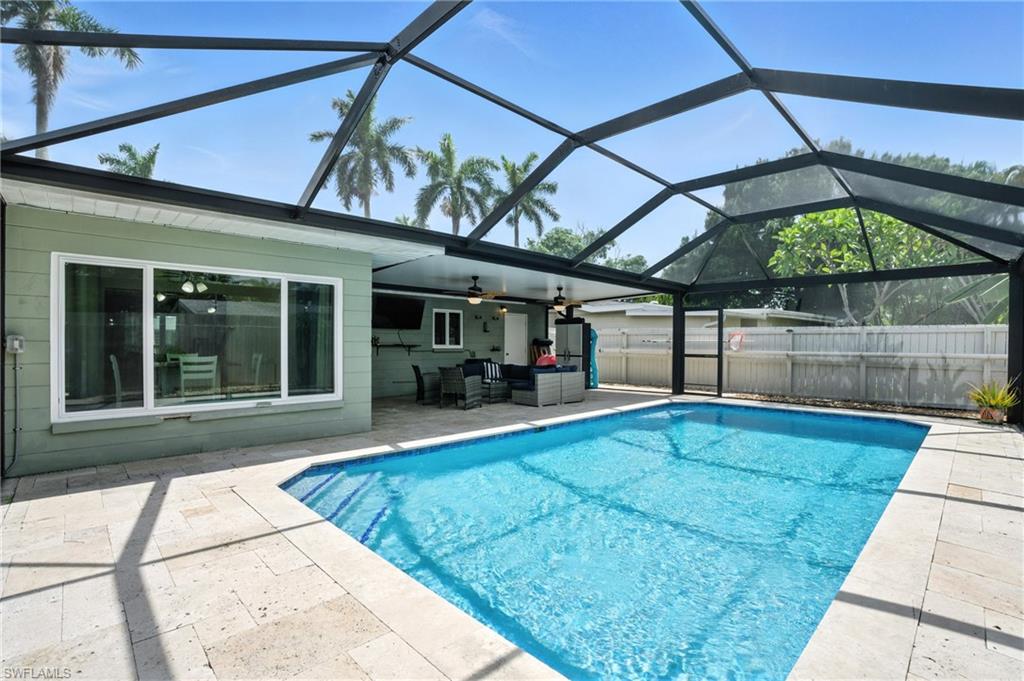 1423 Charles Road Fort Myers, FL 33919 - Photo 20 of 26 View of pool featuring a patio, ceiling fan, and glass enclosure