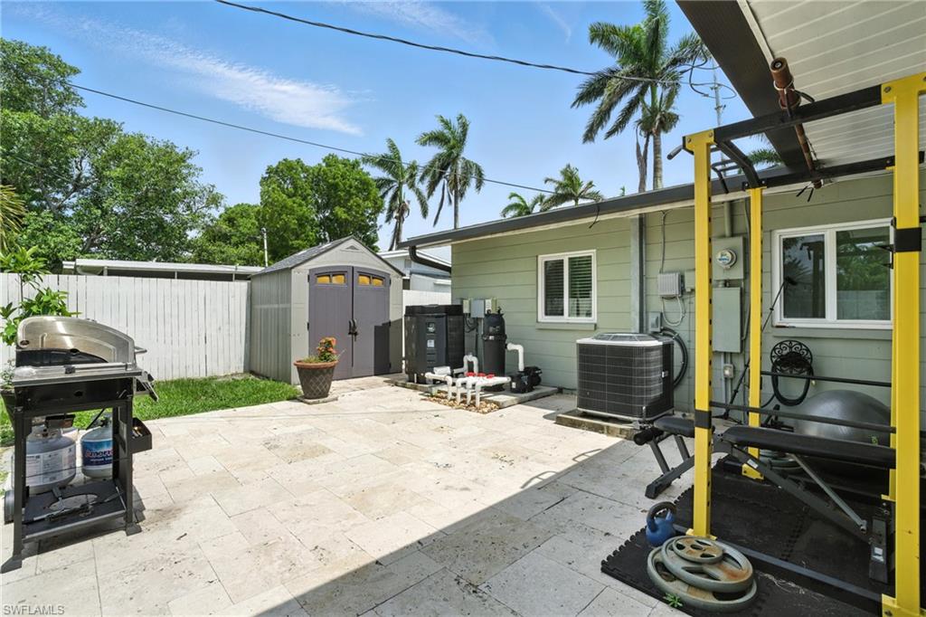 1423 Charles Road Fort Myers, FL 33919 - Photo 23 of 26 View of patio / terrace with a shed and a grill