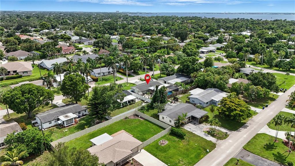1423 Charles Road Fort Myers, FL 33919 - Photo 25 of 26 Aerial perspective of suburban area featuring a large body of water