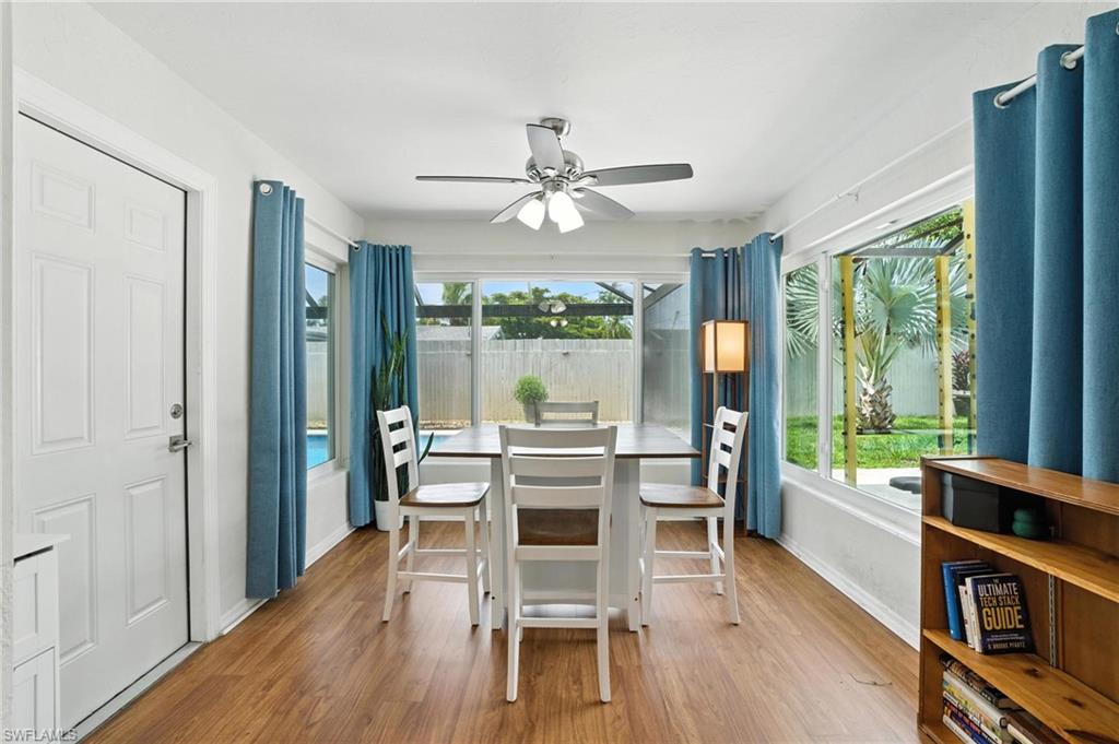 1423 Charles Road Fort Myers, FL 33919 - Photo 5 of 26 Dining area featuring a ceiling fan and wood finished floors