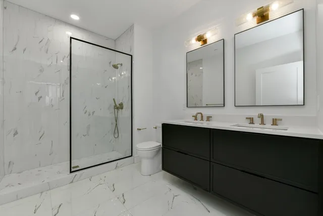 a bathroom with a glass shower door