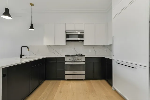 a view of a storage & utility room with wooden floor