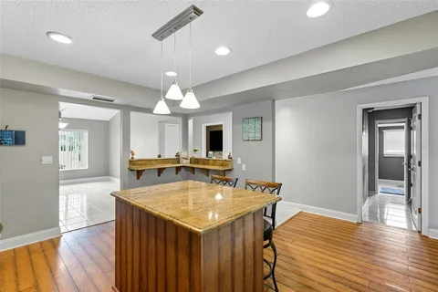 a view of a big room with closet and windows